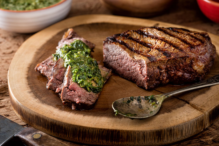 BBQ steak on board with sauce