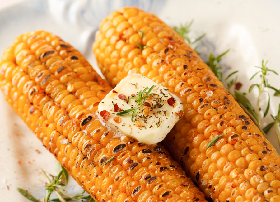 Grilled corn on cob with spicy butter